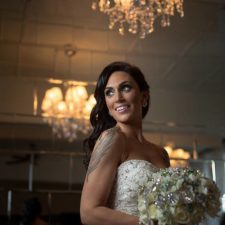 Image of beautiful bride with tattoo holding wedding bouquet in Northwest Indiana's premier wedding venue