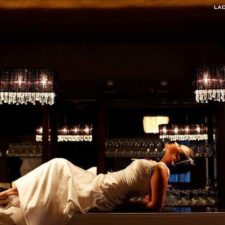 Image of wedding bride on bar posing at The Allure wedding venue